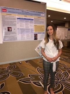Vanessa Muraca discusses work at poster session in May 2019